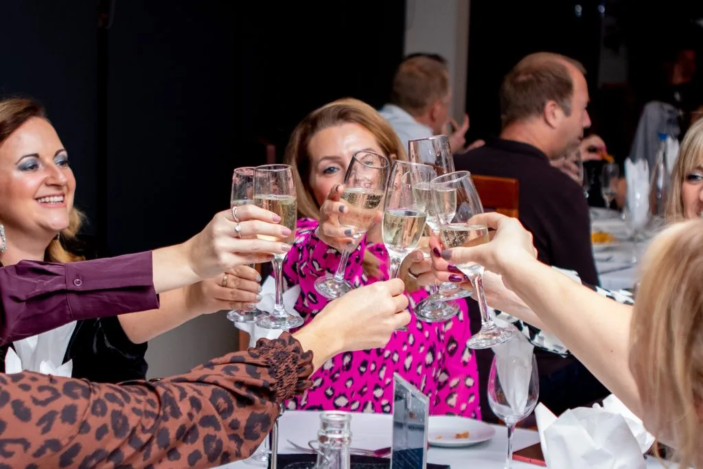 group clinking glasses at a christmas party venue in nottingham