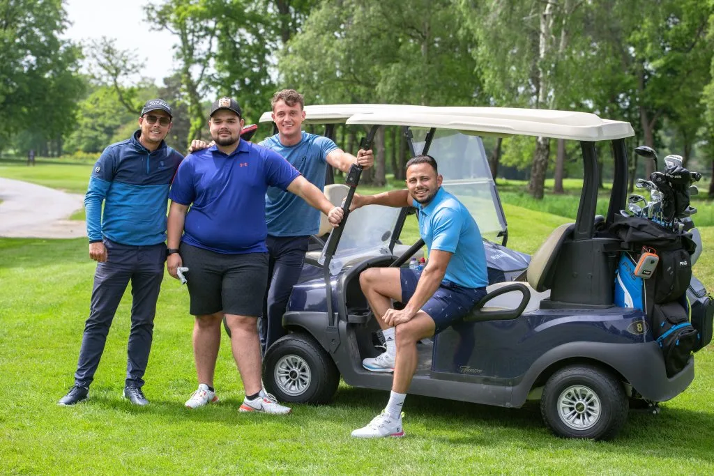 group of young men standing around a golf buggy in nottinghamshire