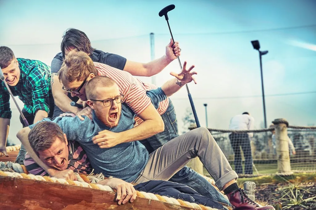 groups of adults playing around whilst playing crazy golf in calverton