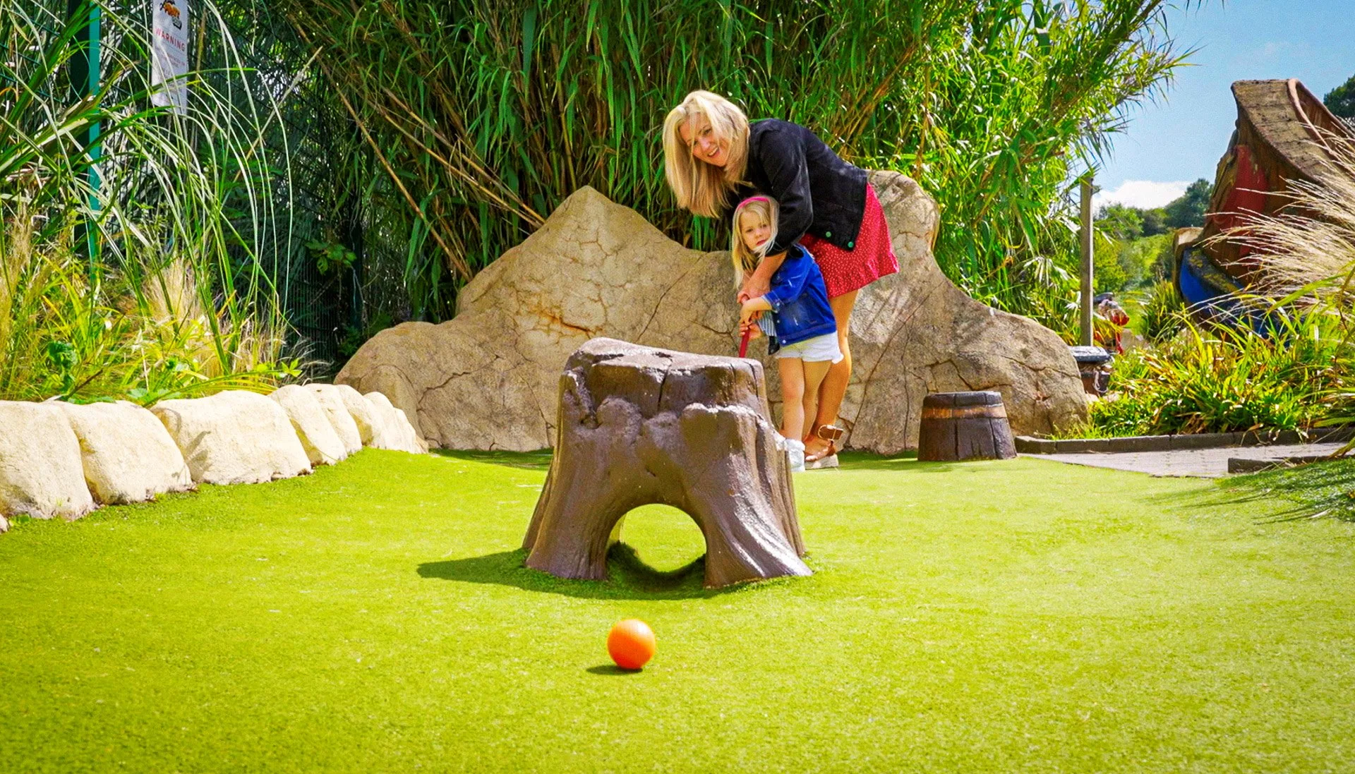 Mother and daughter playing crazy golf in nottingham