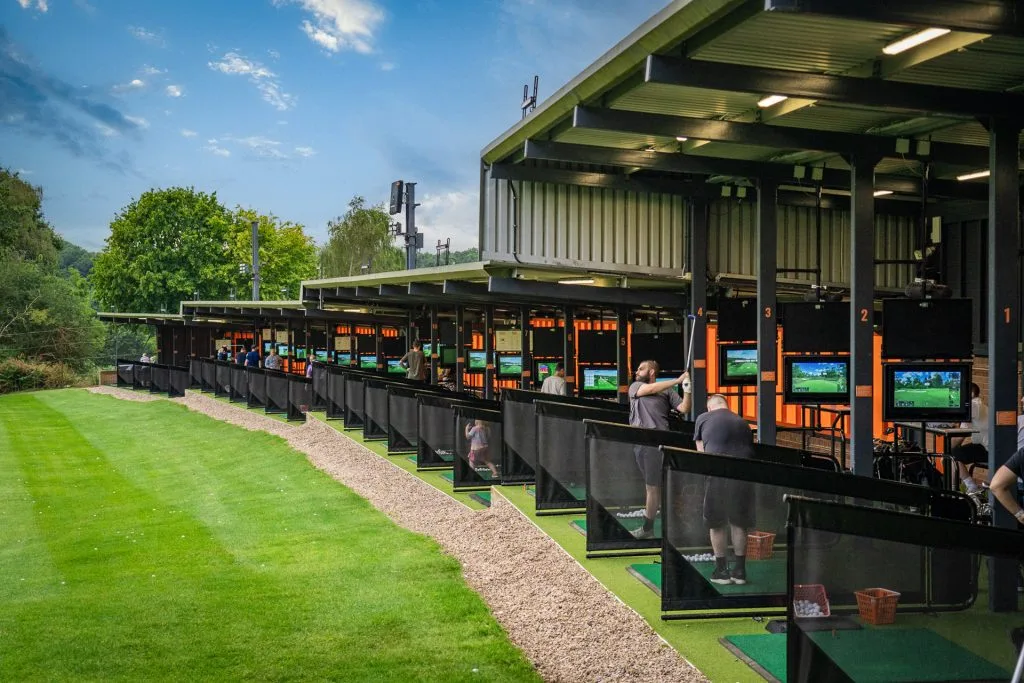 golfers hitting balls out of the trackman driving range in nottinghamshire